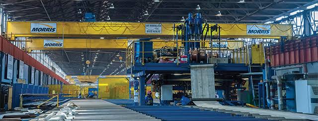 Heavy fabrication workshop with overhead cranes and steel handling bays